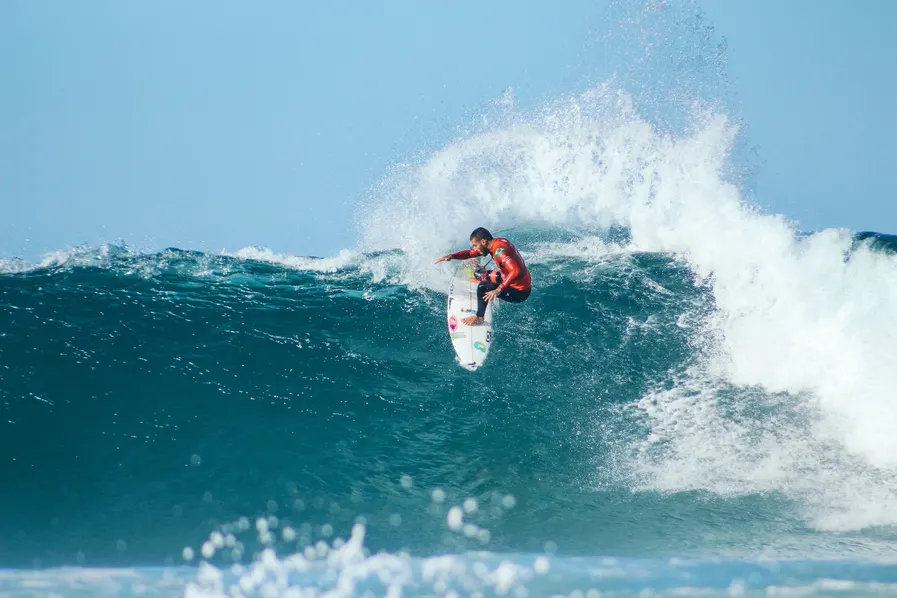 Man in Queensland surfing a big wave