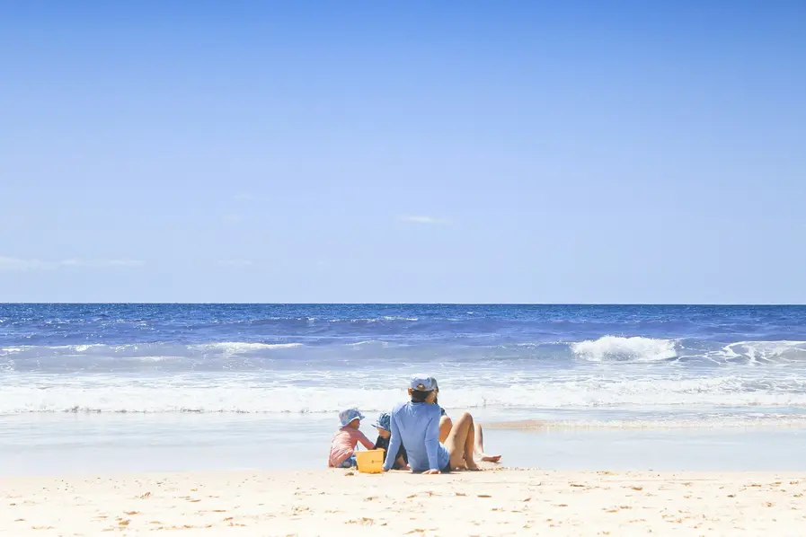 Family enjoying a day out at Bramston Beach in Tropical North Queensland