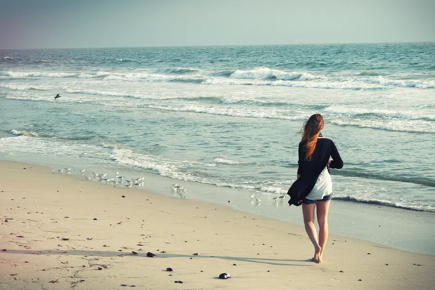 Woman clearing her head during a beach walk