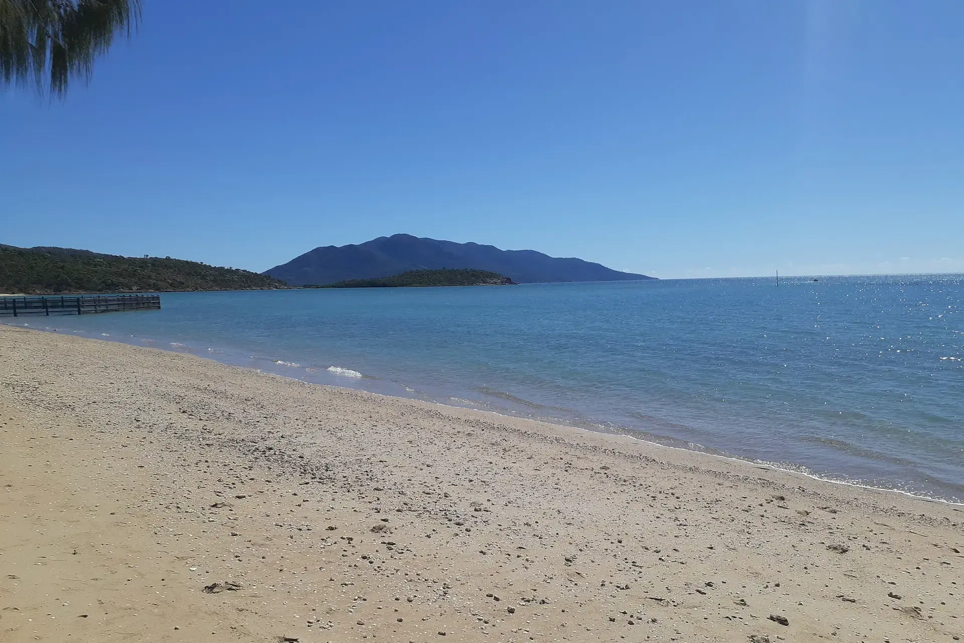 Horseshoe Bay in Bowen with the Whitsunday Region features stunning blue waters and golden sand.