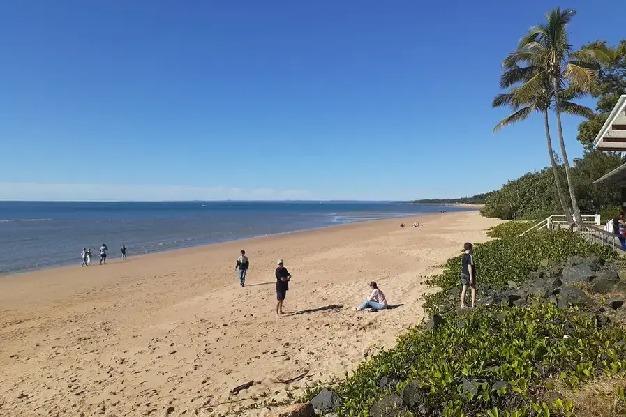 Scenic view of Scarness Beach in Hervey Bay, showcasing golden sands and gentle waves along Queensland's Fraser Coast.