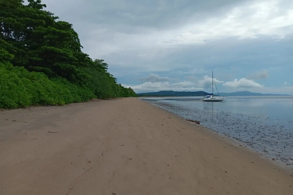 Boat moored at Cooya Beach Near Cairns on a beautiful day.