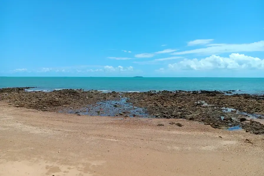 View of rocks and the Coral Sea at Clairview Beach in Queensland